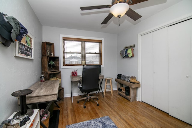 office space with wood-type flooring and ceiling fan