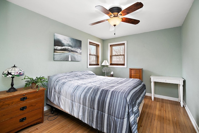 bedroom featuring ceiling fan and dark wood-type flooring