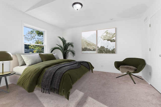 bedroom with light colored carpet