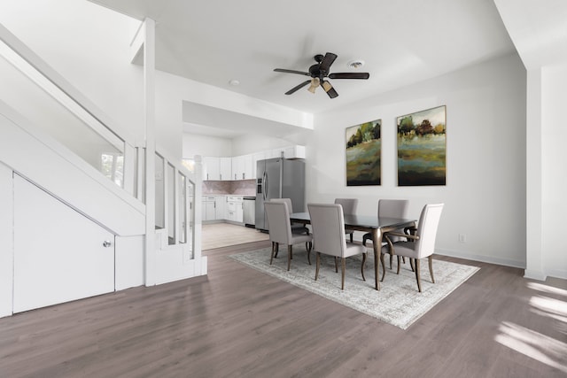 dining room featuring ceiling fan and dark hardwood / wood-style floors