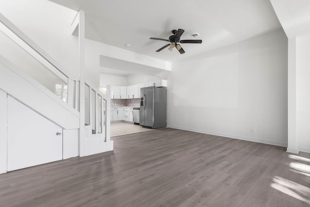 unfurnished living room featuring light hardwood / wood-style floors and ceiling fan