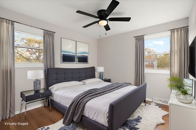 bedroom featuring wood-type flooring and ceiling fan