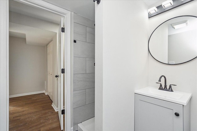 bathroom with hardwood / wood-style floors and vanity