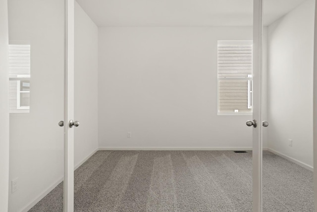 spare room featuring carpet floors