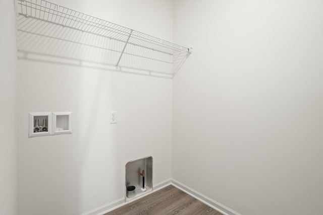 laundry room with hardwood / wood-style flooring and hookup for a washing machine