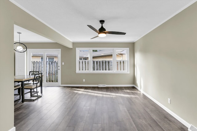 unfurnished room with ceiling fan and dark hardwood / wood-style flooring