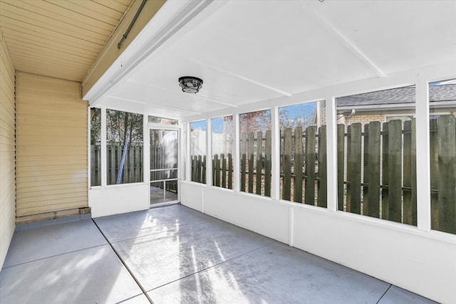 unfurnished sunroom featuring plenty of natural light