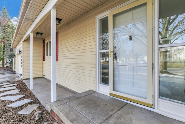 view of exterior entry featuring a garage