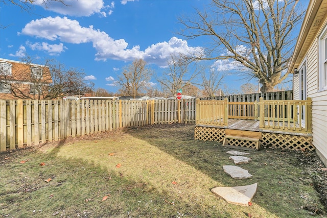 view of yard featuring a wooden deck