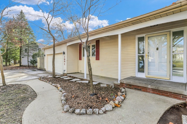 view of exterior entry with a garage