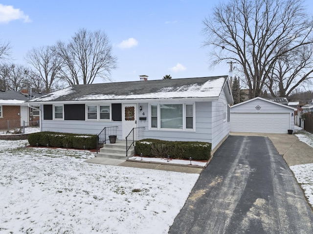 view of front of home featuring an outbuilding and a garage