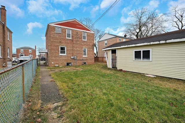 back of house with a yard