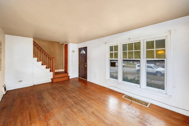 entrance foyer with hardwood / wood-style floors