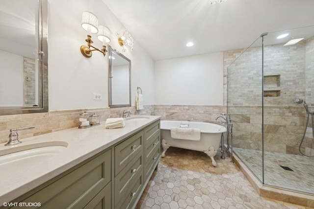 bathroom with tile walls, tile patterned floors, vanity, and shower with separate bathtub