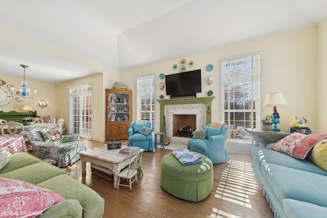 living room featuring a notable chandelier and hardwood / wood-style flooring