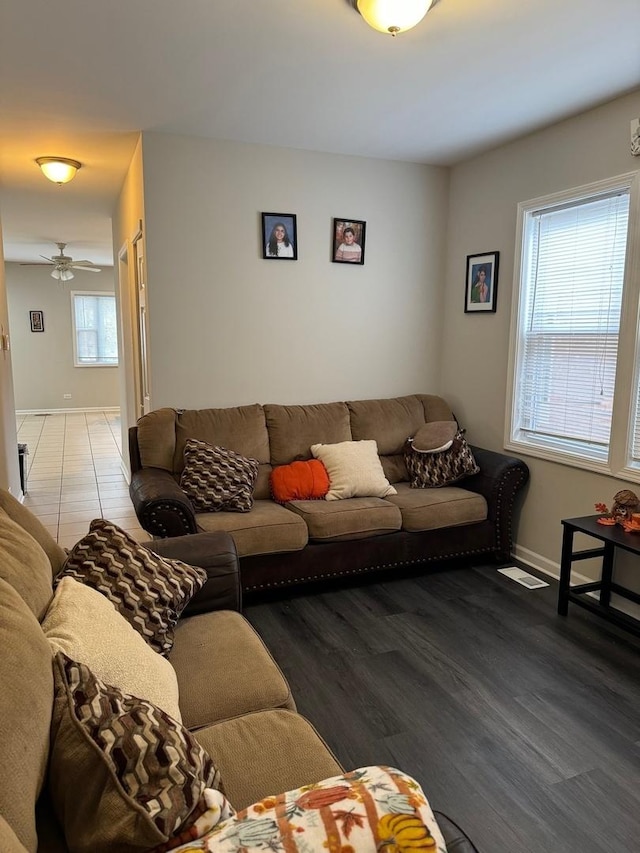 living room featuring hardwood / wood-style flooring, ceiling fan, and a wealth of natural light