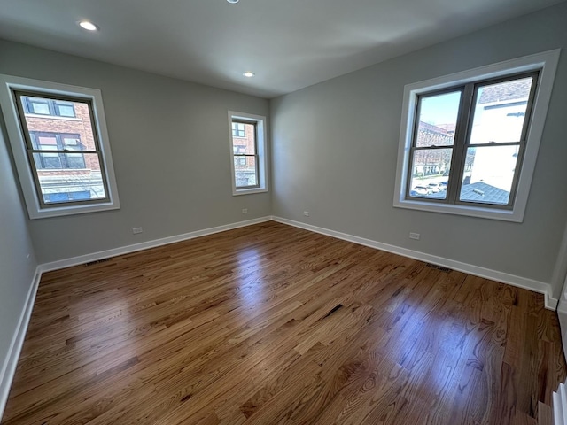 unfurnished room featuring wood-type flooring