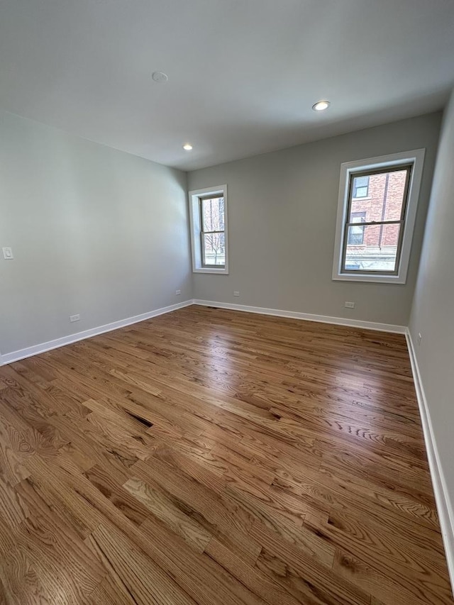 unfurnished room with light hardwood / wood-style floors