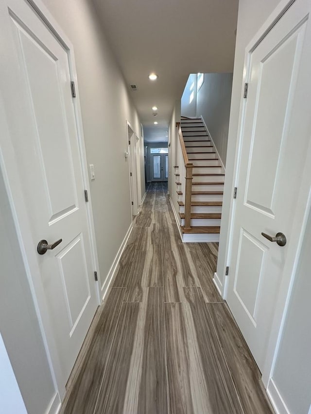 hall with dark wood-type flooring