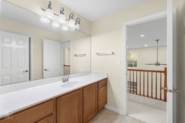 bathroom featuring tile patterned flooring and vanity