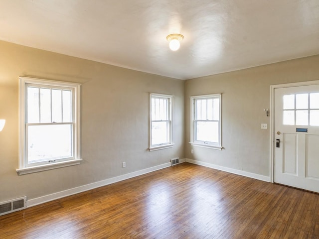 entryway featuring hardwood / wood-style floors and a healthy amount of sunlight