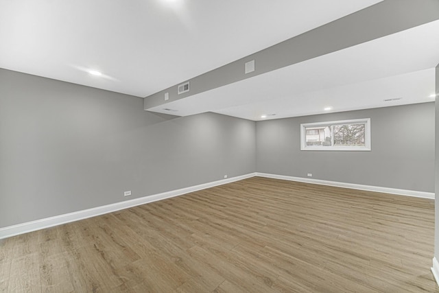 basement featuring light hardwood / wood-style flooring