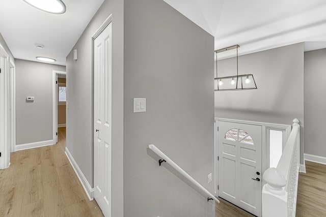 entryway with wood-type flooring