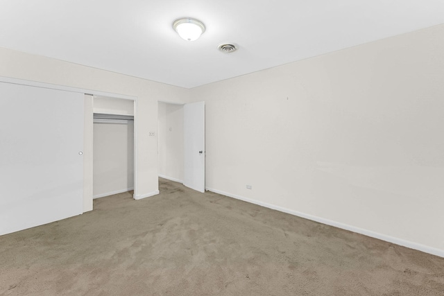 unfurnished bedroom featuring a closet and carpet