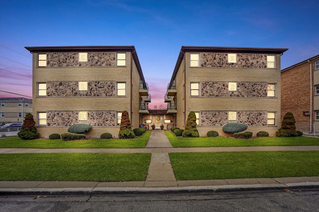 view of outdoor building at dusk