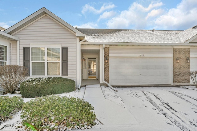 ranch-style house featuring a garage