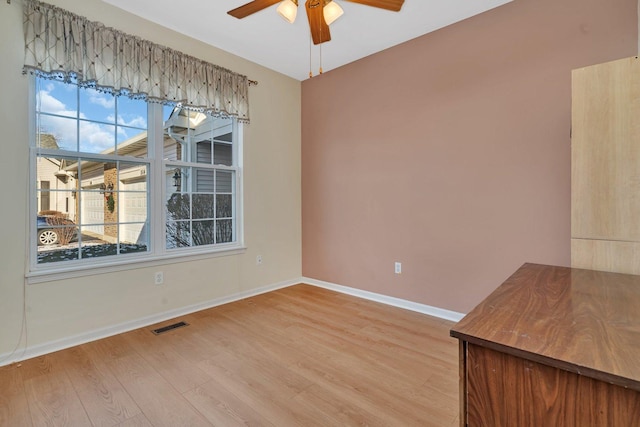 unfurnished dining area with hardwood / wood-style floors and ceiling fan