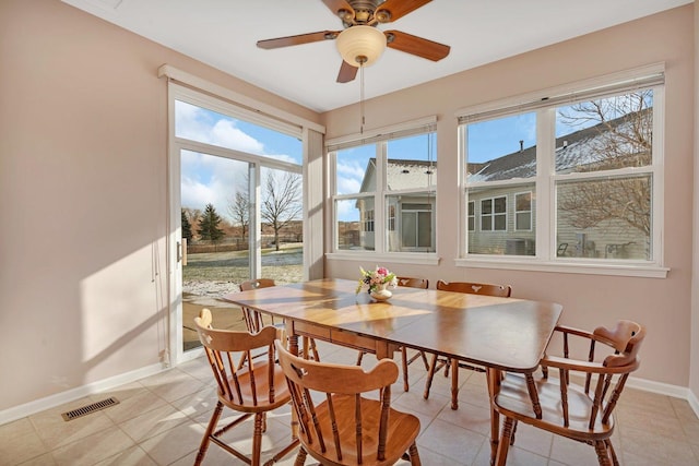 dining area featuring ceiling fan and light tile patterned flooring