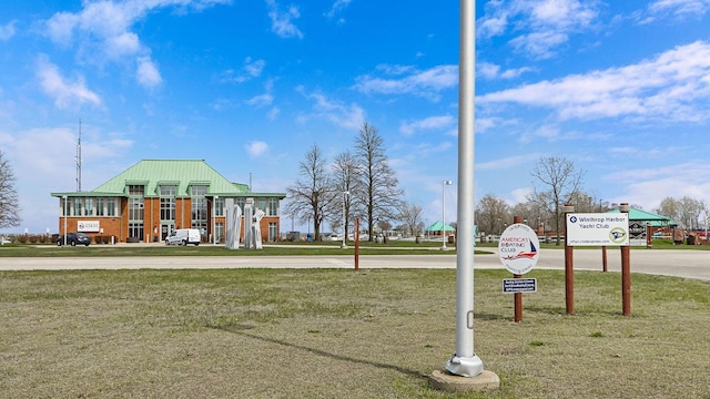 view of home's community with a lawn