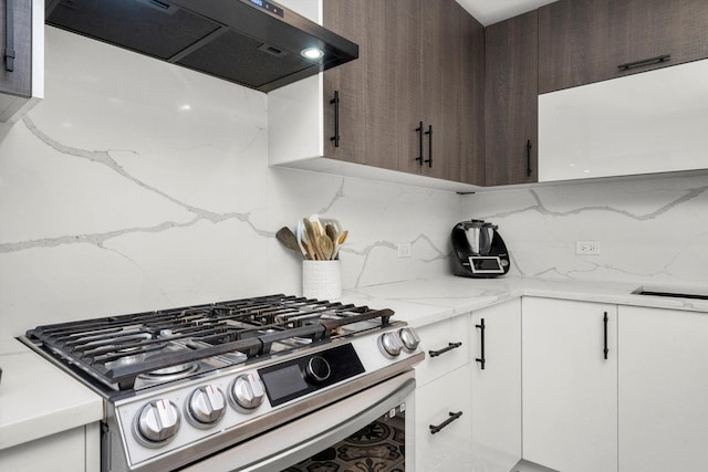 kitchen with white cabinetry, ventilation hood, backsplash, dark brown cabinets, and stainless steel stove