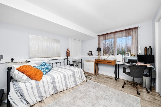 bedroom with light hardwood / wood-style floors