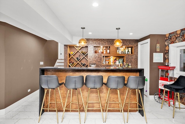 bar featuring pendant lighting