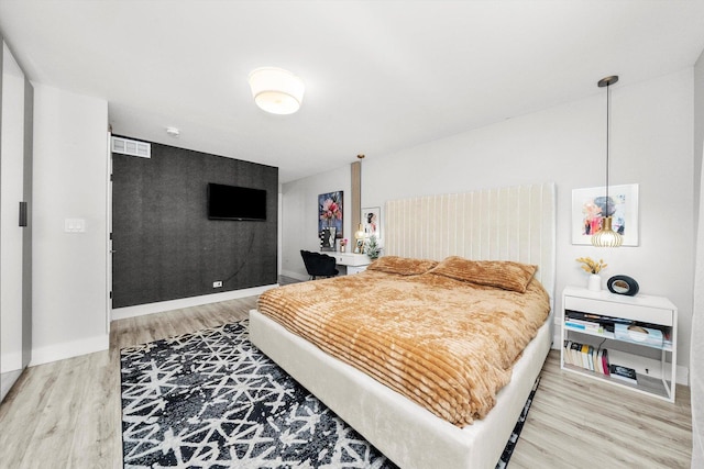 bedroom with wood-type flooring