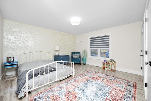 bedroom with wood-type flooring