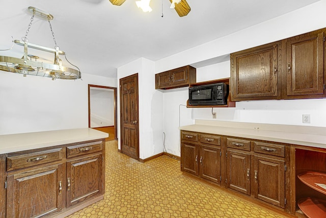 kitchen with decorative light fixtures and ceiling fan