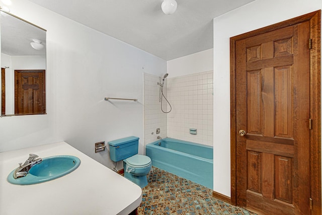 full bathroom with toilet, vanity, and tiled shower / bath combo