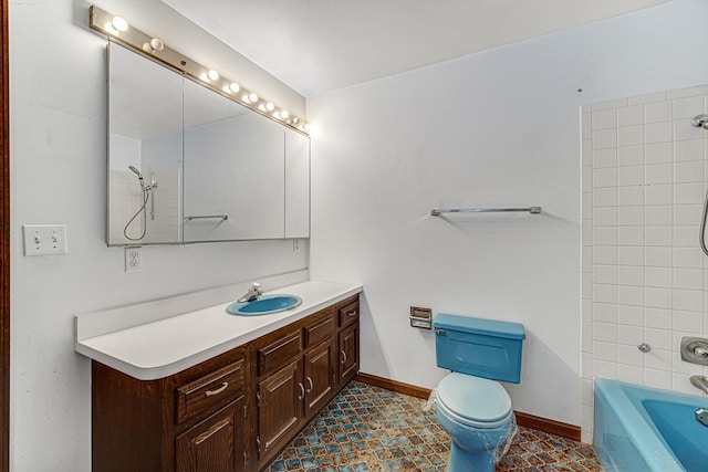 full bathroom with toilet, tiled shower / bath combo, and vanity