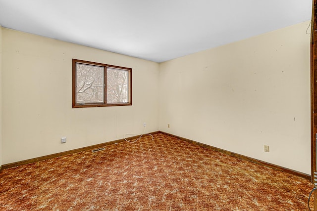 empty room with carpet flooring