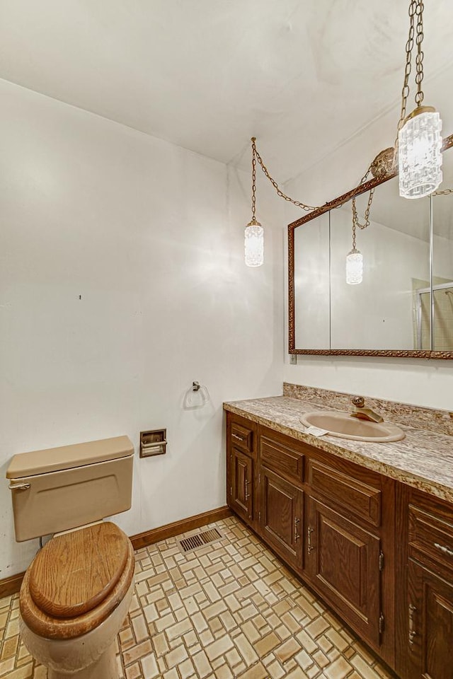 bathroom with vanity and toilet