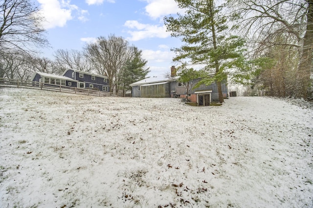 view of yard covered in snow