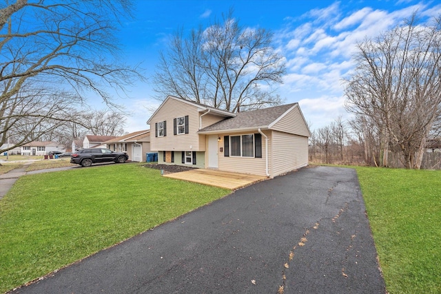 split level home with a front lawn