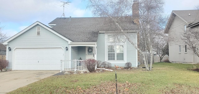 view of front of house featuring a garage and a front yard