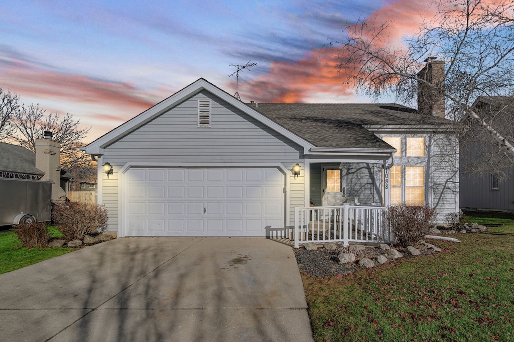 single story home with a garage