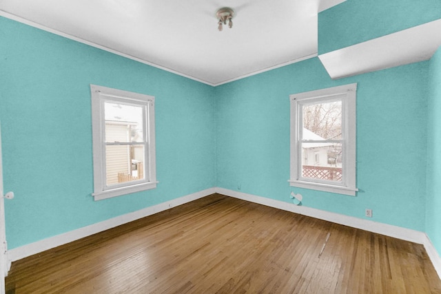 1009 Augusta Ave, Elgin, IL 60120 - unfurnished room featuring wood finished floors, ornamental molding, and baseboards