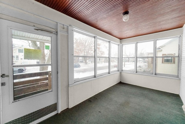 unfurnished sunroom featuring wood ceiling