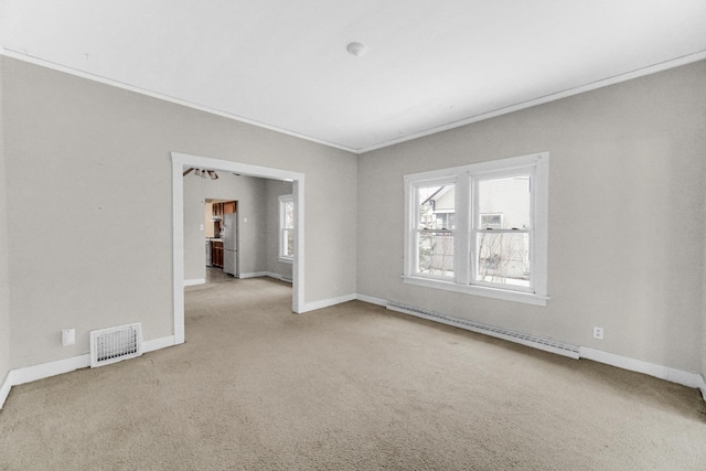 1009 Augusta Ave, Elgin, IL 60120 - carpeted empty room featuring baseboard heating, ornamental molding, and baseboards